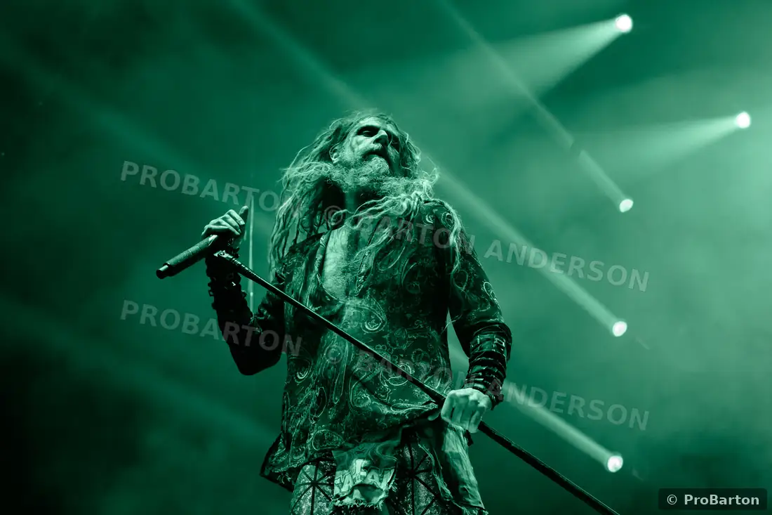 Rob Zombie under green stage lighting